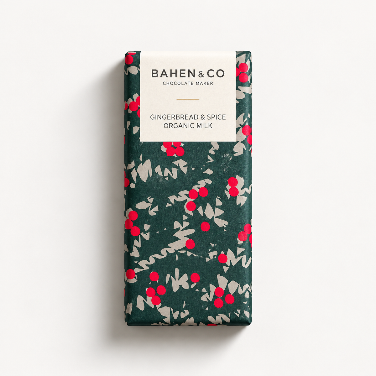 A packaged chocolate bar from Bahen & Co, featuring a dark green wrapper with a red and beige floral pattern and a white label at the top.