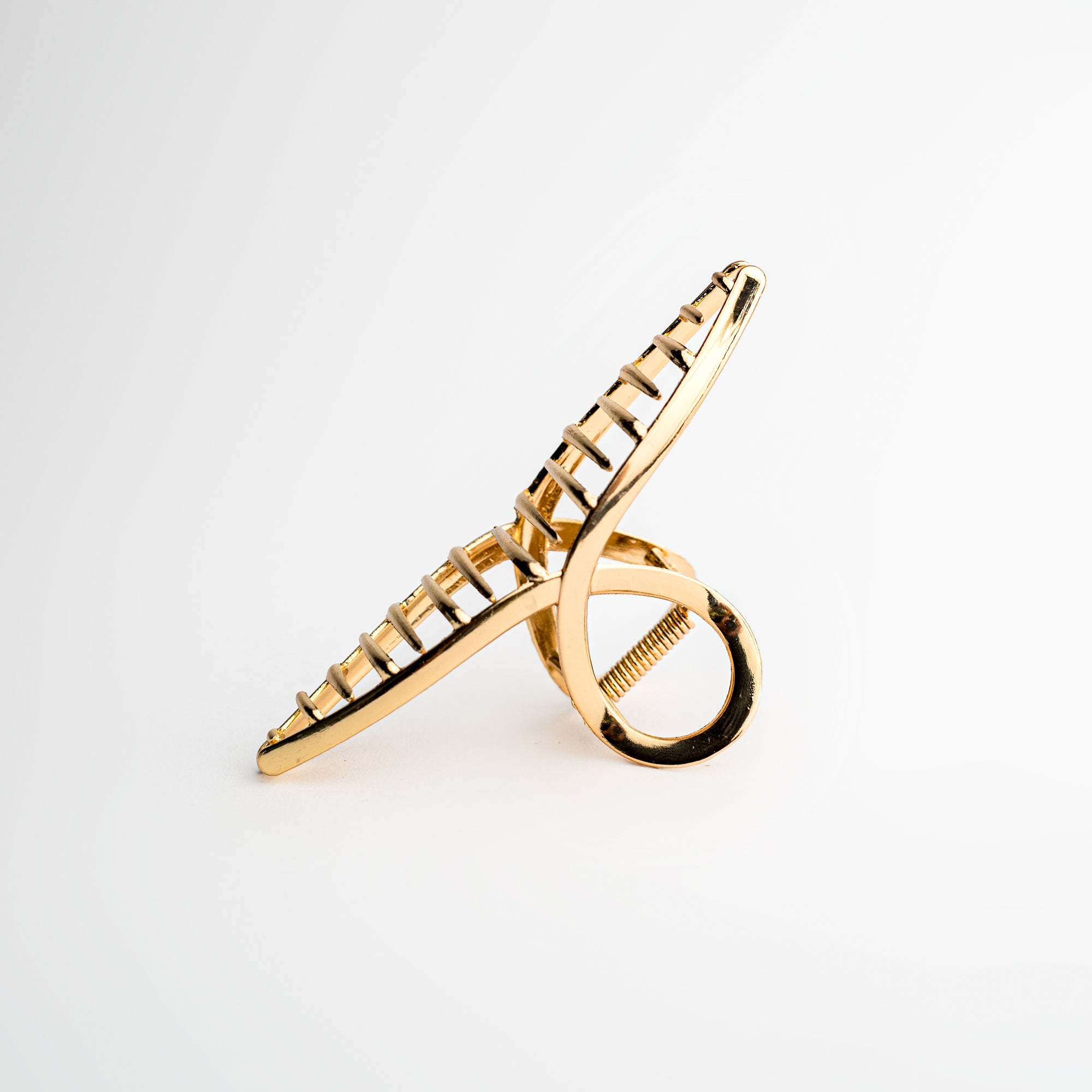 Gold hair claw on a white background.