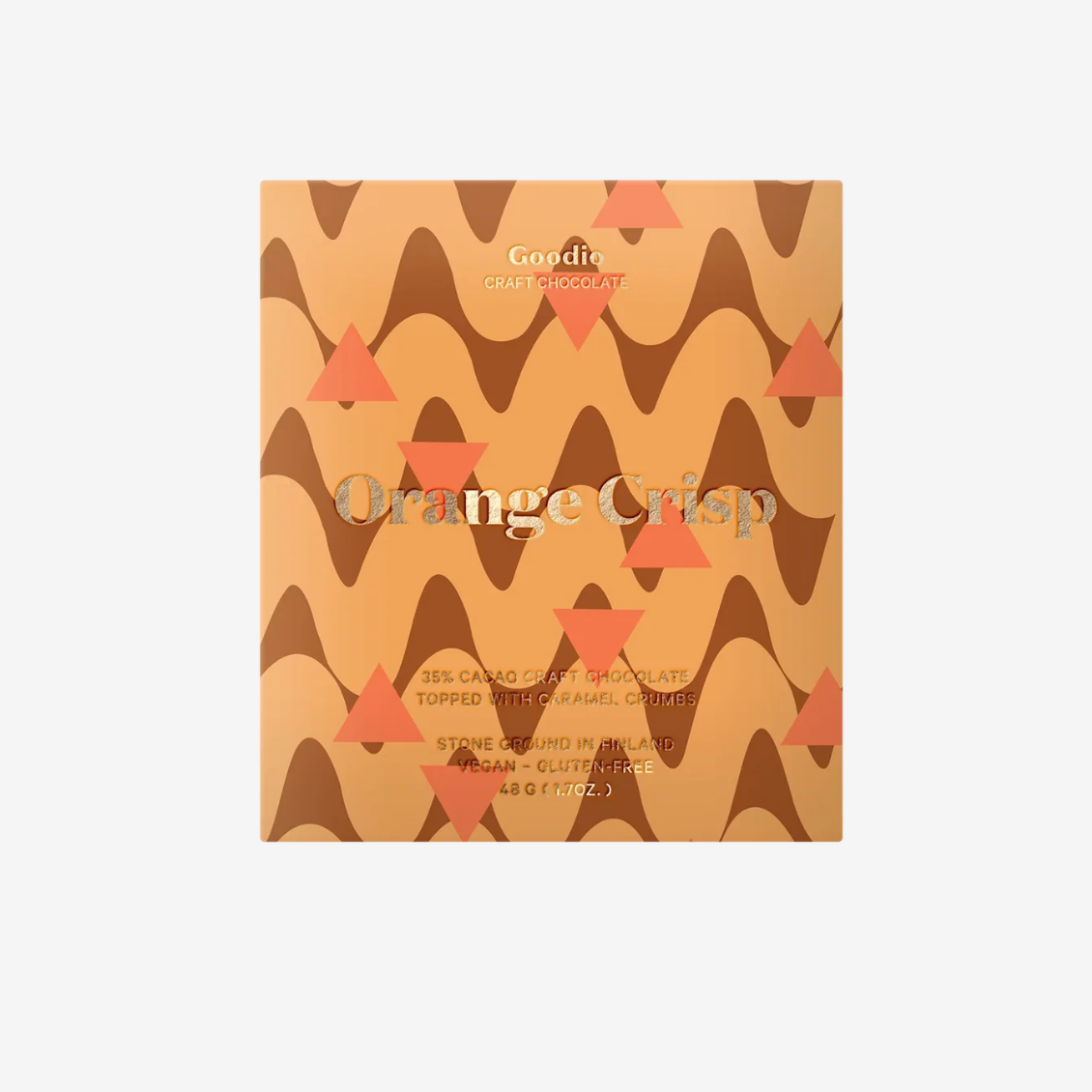Packaging of Goodie Orange Crisp craft chocolate with wavy pattern and orange triangles on a beige background.