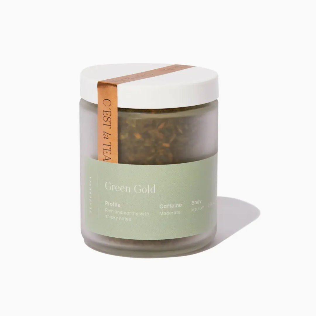 Green tea jar with a white lid on a white background