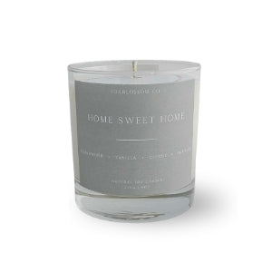 Candle with 'Home Sweet Home' text on a white background