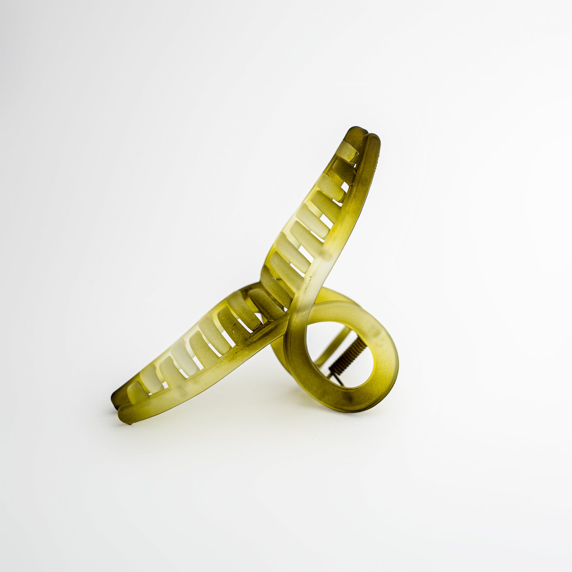 Jelly green hair claw on a white background.