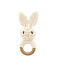 Knitted bunny rattle beige on a white background. 