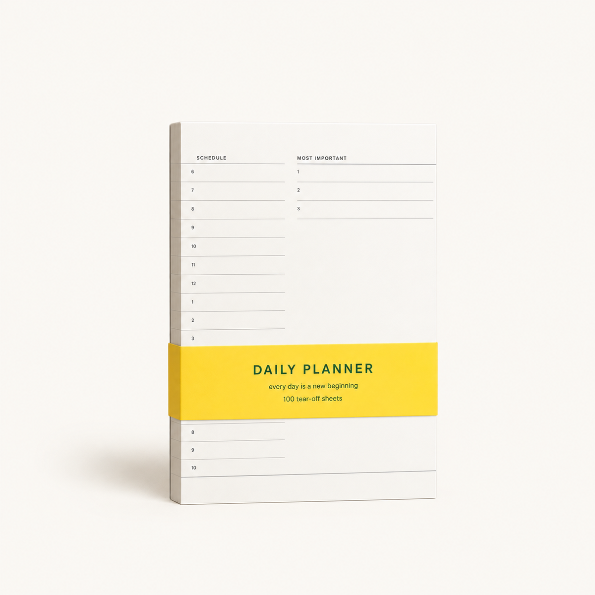 A white daily planner notebook with a bright yellow horizontal band across the middle, standing upright on a light beige background.