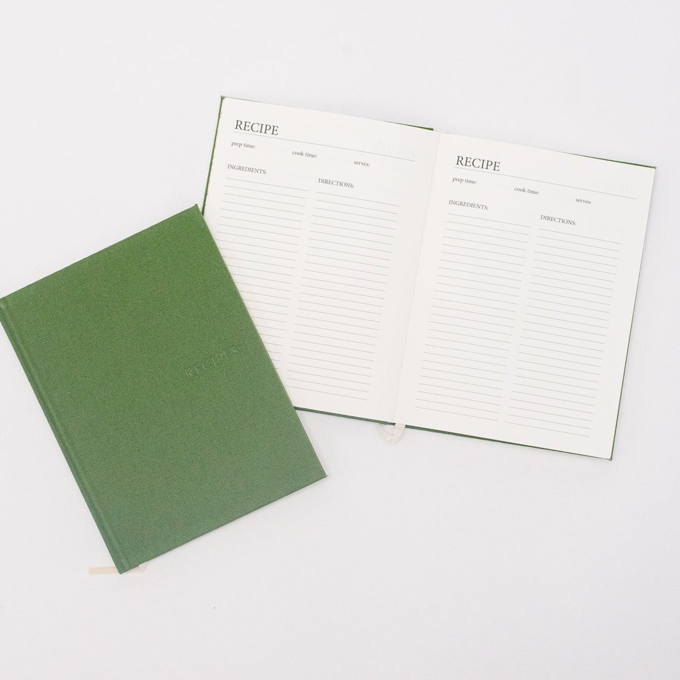 Green recipe book opened and closed