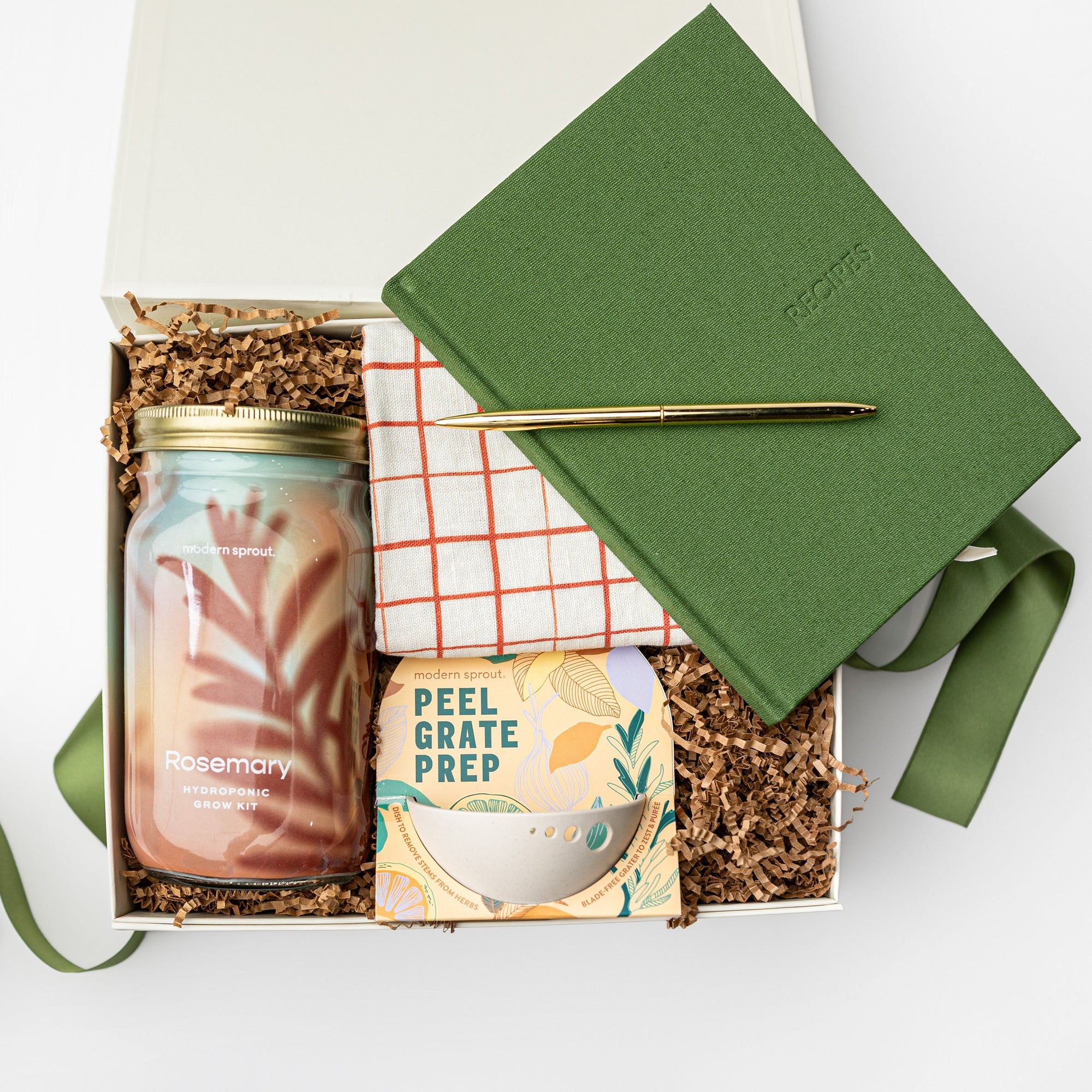 Gift box with a jar, notebook, and other items on a white background