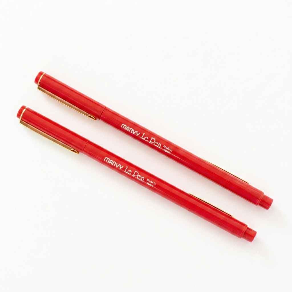 Marvy U. Red le pen marker, two red colored shown, in their in a white background.