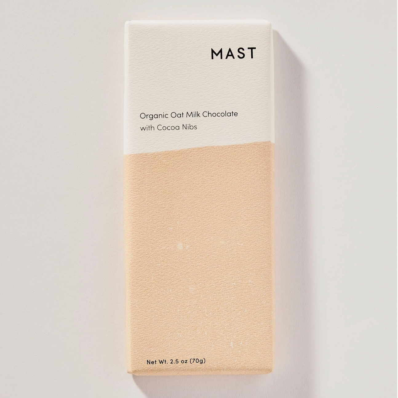 Mast Organic Oat Milk Chocolate with Cocoa Nibs packaging on a light gray background