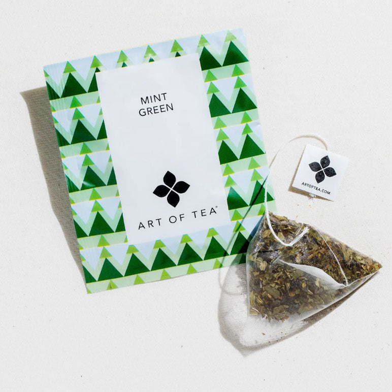 Mint Green Tea from art of tea in a geometrical tree background image sachet and white square label.