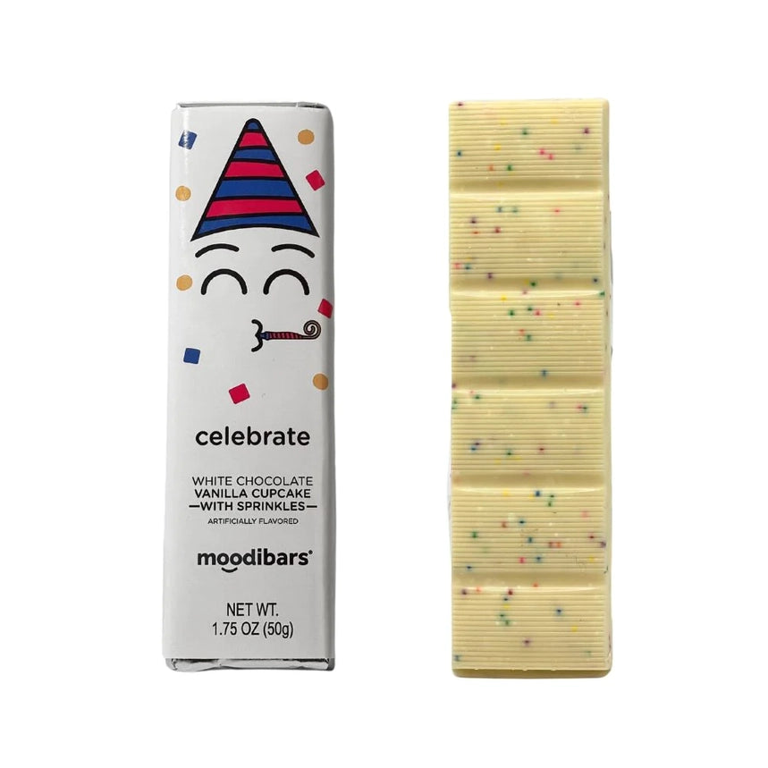 Celebrate, Moodibars, white chocolate bar is featured, featuring a celebration-themed graphic, a cartoon face wearing a party hat and party horn and surrounded by colorful confetti, expressing a celebratory mood. The text indicates it is white chocolate with vanilla cupcake flavor and sprinkles. The Moodibars logo and the product's net weight are also displayed in a smaller font in black, and next to it the chocolate bar is open white with colorful sprinkles. 