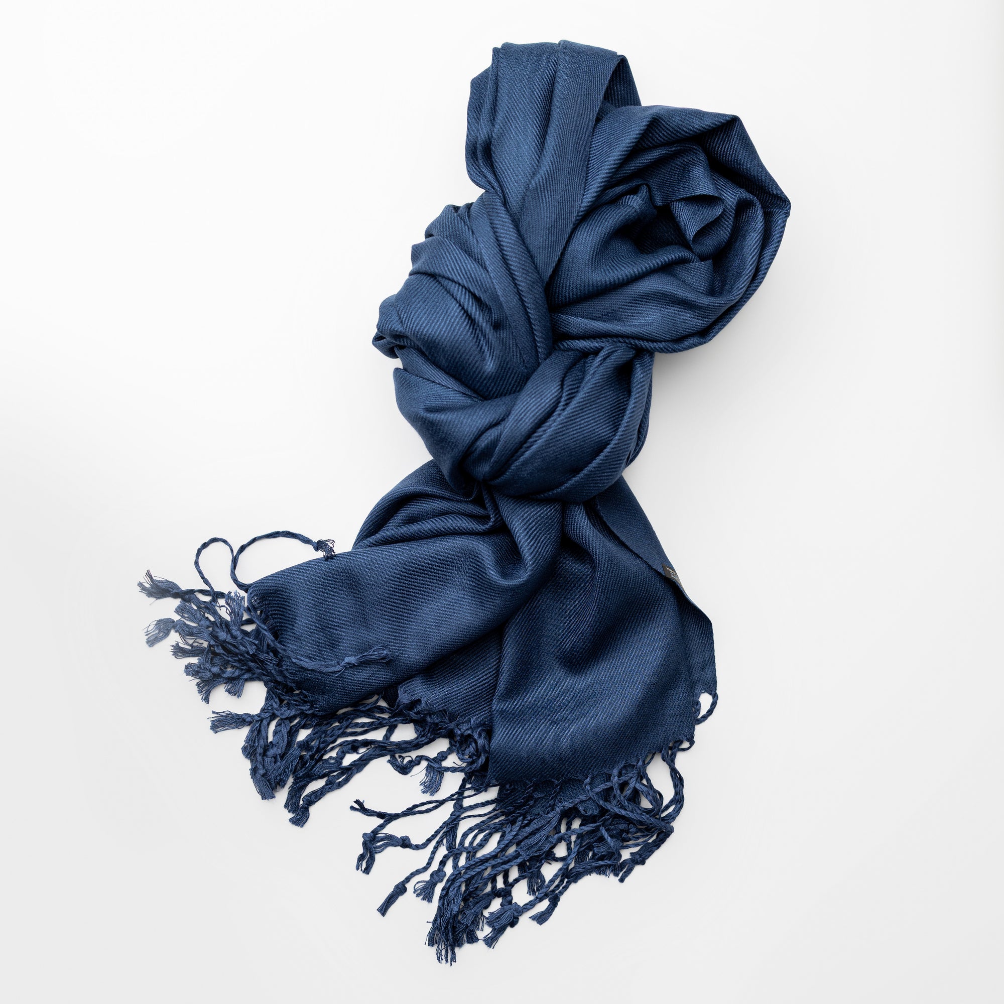 Midnight Blue scarf with tassels on a white background