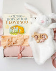 Baby gift set with 'Guess How Much I Love You' book, bunny, headband, and teether in a box.