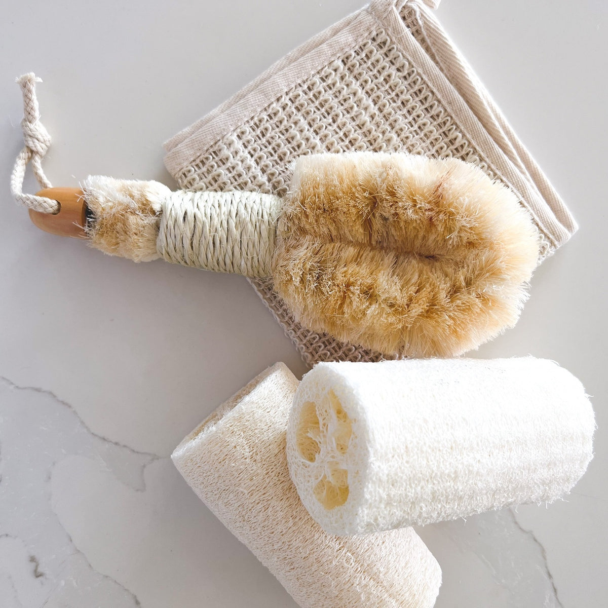 Nordic dry brush featured in a spa setting image in a marble like image. 