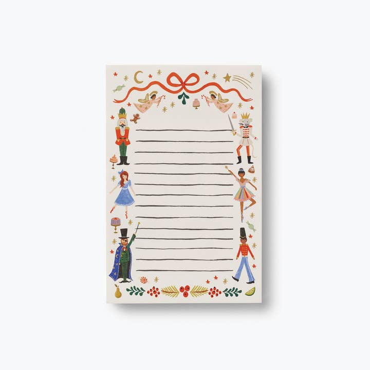 The Nutcracker notepad is featured on a white background. It has Christmas images and red bow printed on the top.