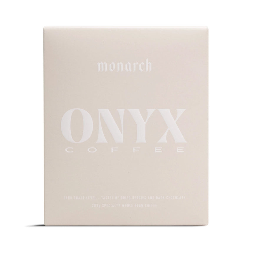 Onyx monarch coffee is featured in its beige square-shaped package  and white lettering on a white package. 
