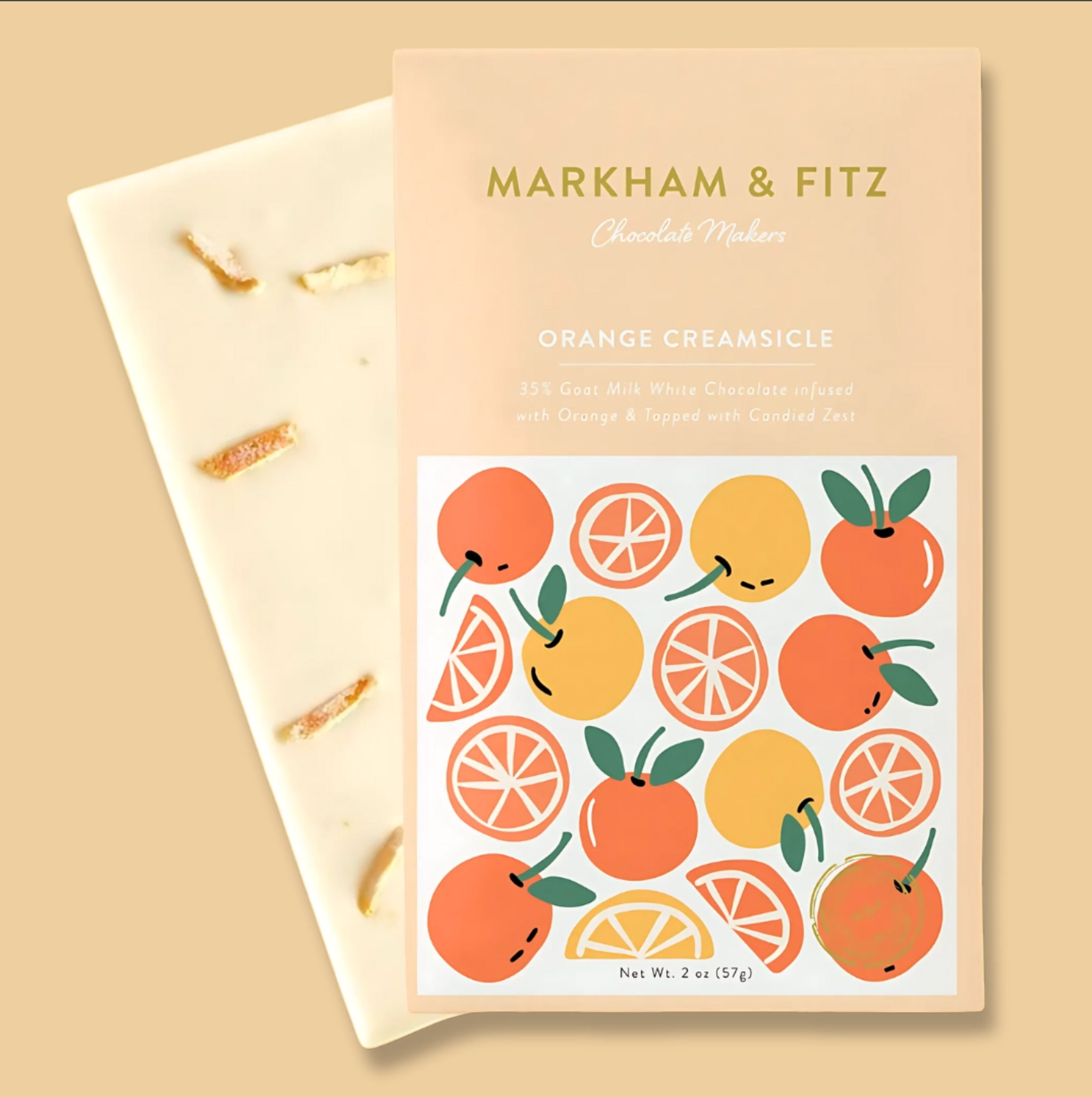 Chocolates with a 'Markham & Fitz' packaging featuring orange and lemon illustrations on a beige background.