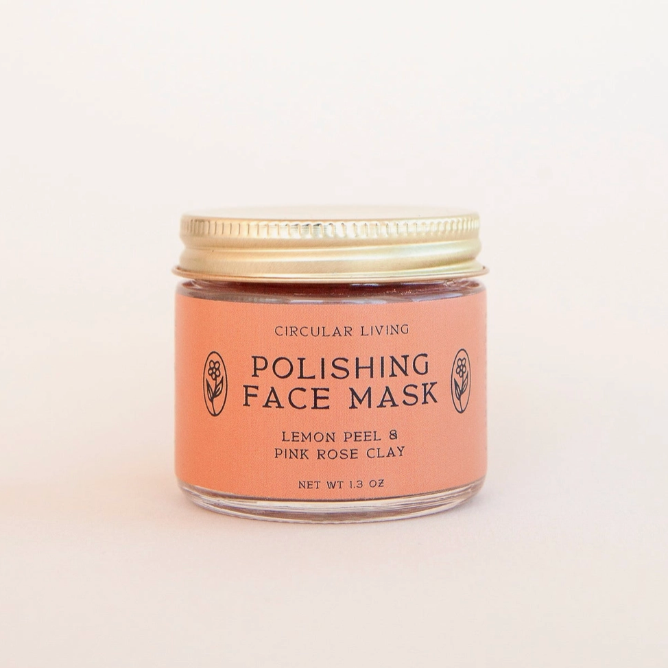 A small glass jar of Circular Living Polishing Face Mask with a peach-colored label and a gold metal lid, set against a plain off-white background.