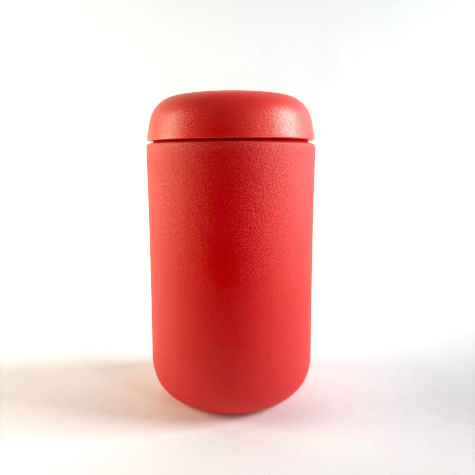 15oz  red travel mug is featured in its cylindrical shape on a white background. 