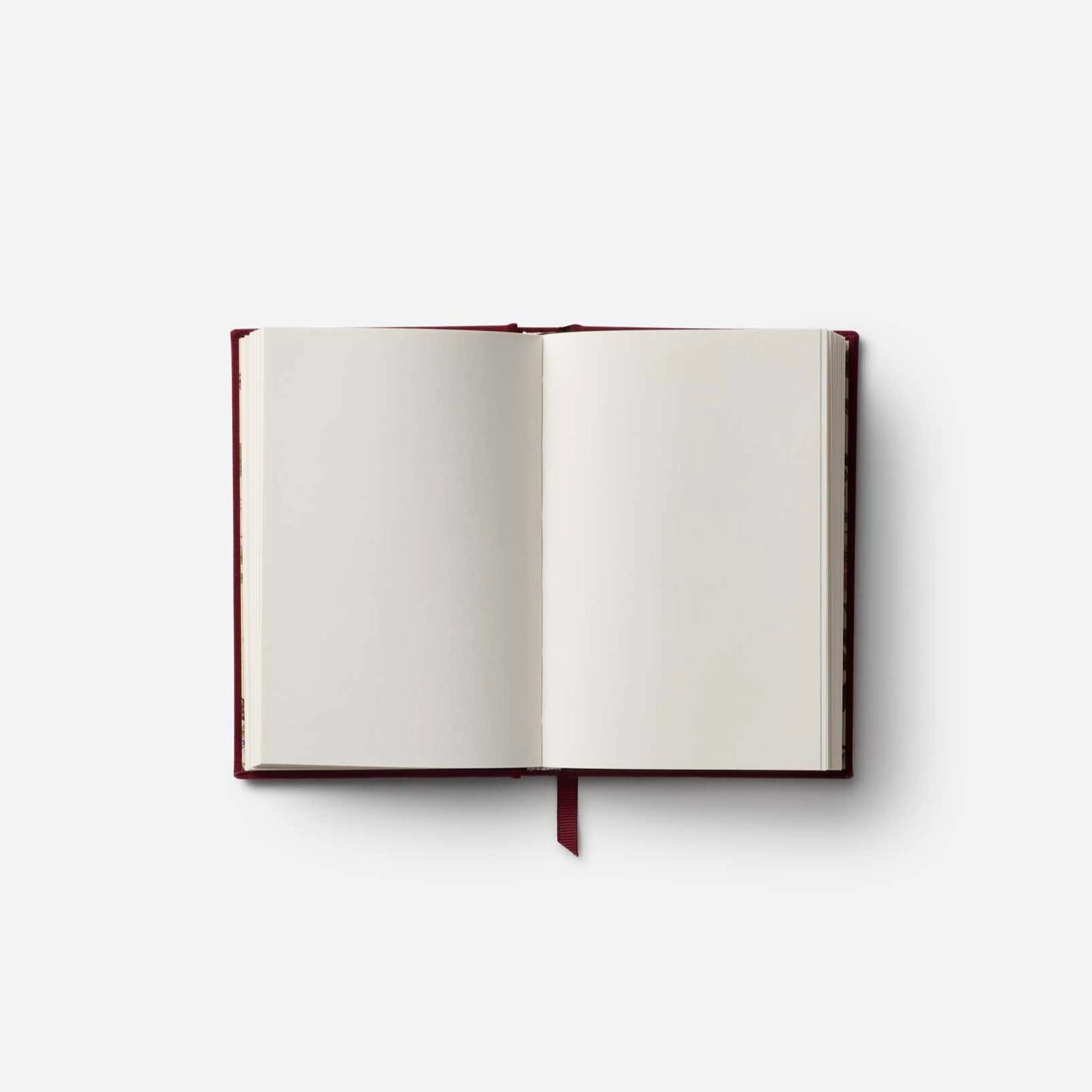 Open notebook with blank pages on a white background
