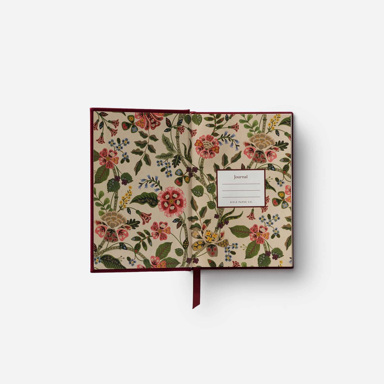 Floral-patterned journal on a white background