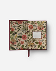 Floral-patterned journal on a white background