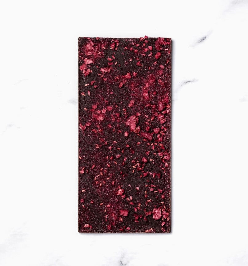 Image of the apres chocolate bar from ritual opened, a dark chocolate with raspberries. 