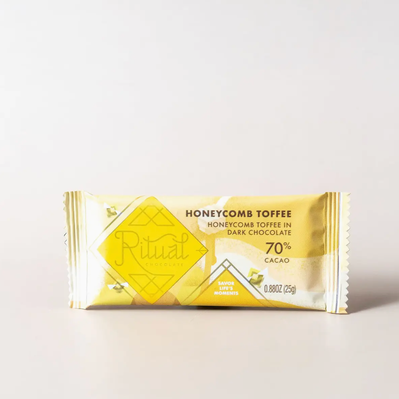 Ritual honeycomb toffee chocolate bar packaging on a light background