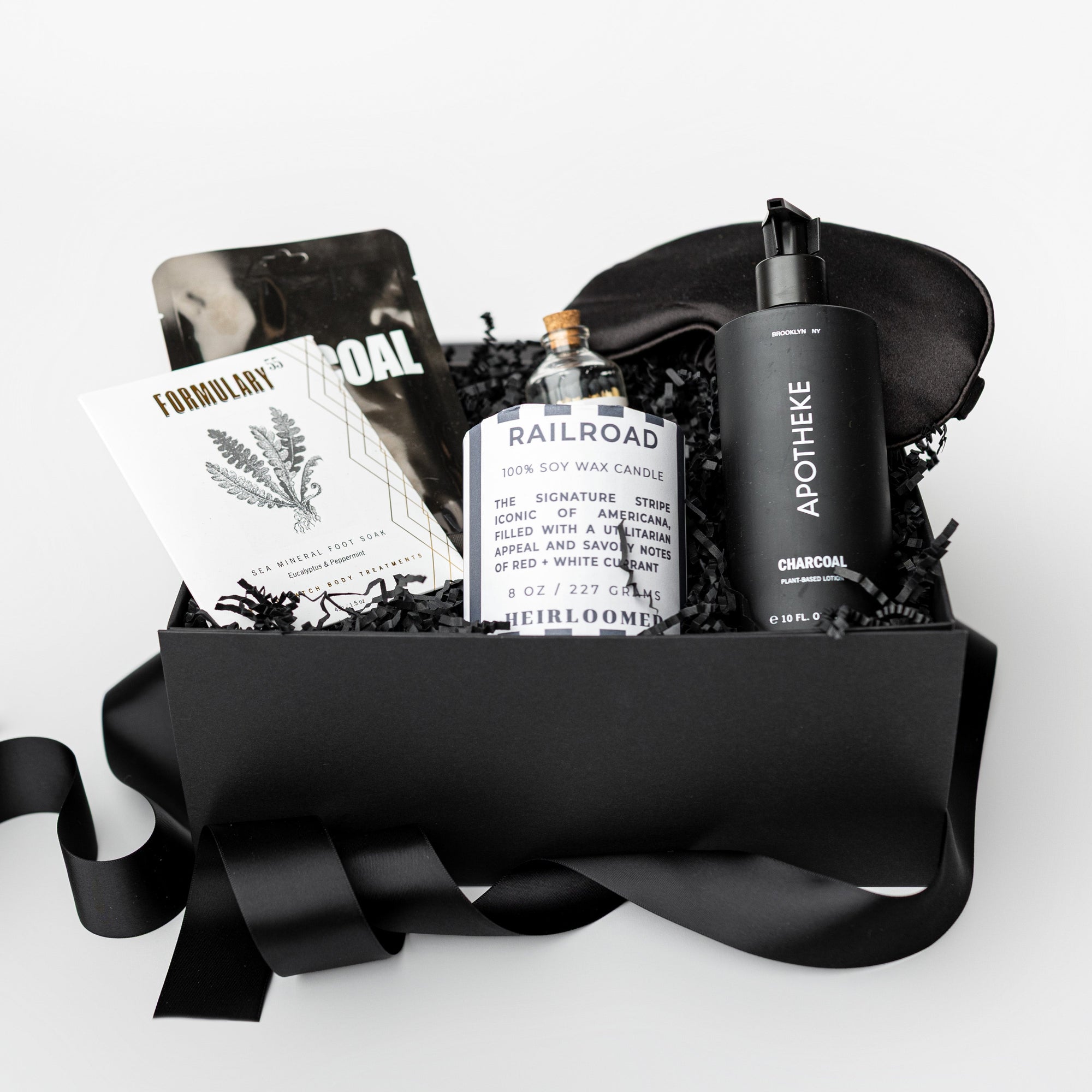 Gift basket with black ribbon on a white background