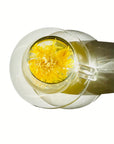 Royal Chrysanthemum flower tea in a glass tea mug on a white background, premium herbal tea.