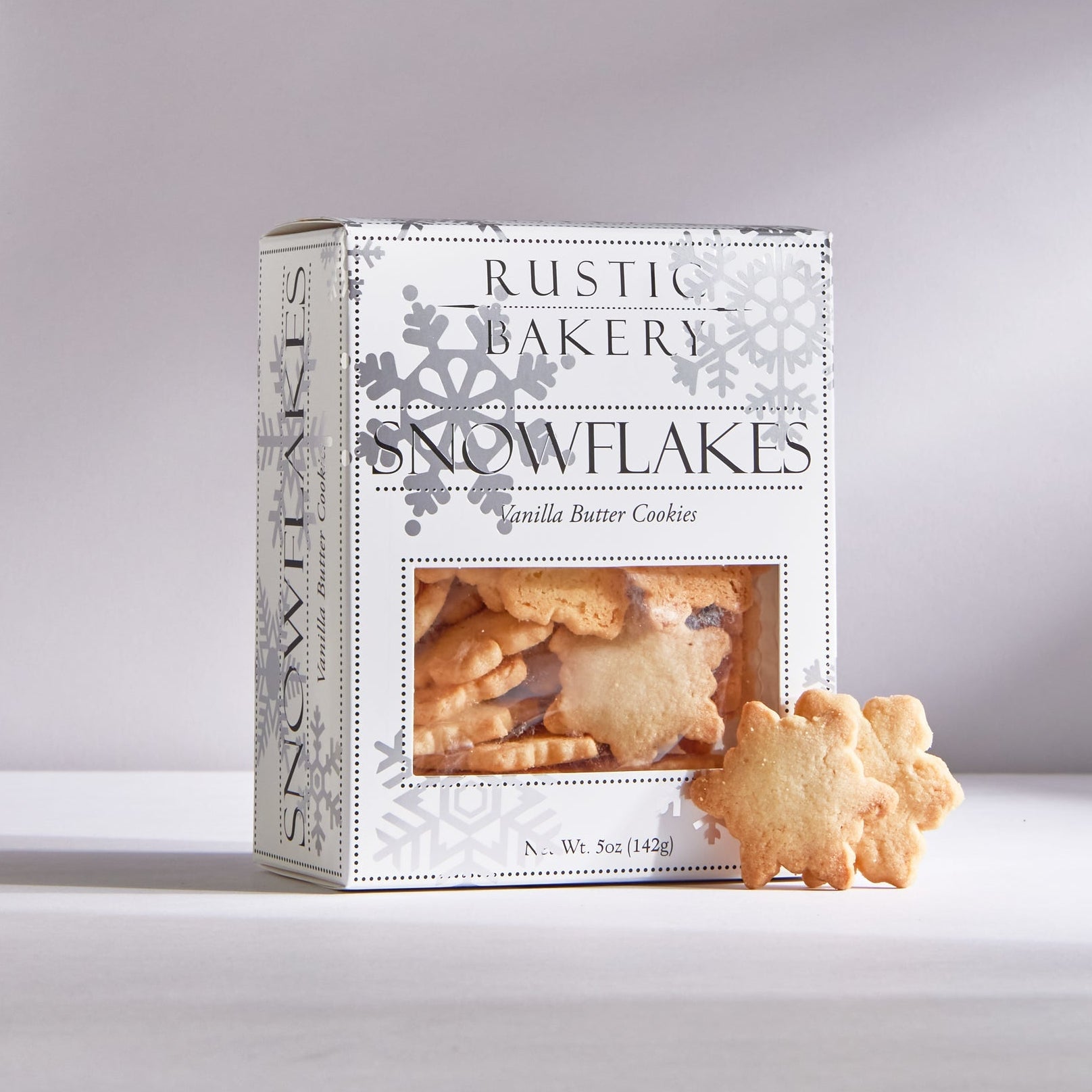 Box of Rustic Bakery Snowflakes Vanilla Butter Cookies on a light gray background.