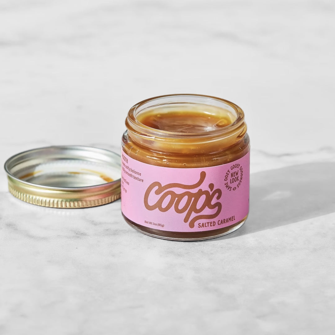 Jar of Coop's salted caramel on a light background
