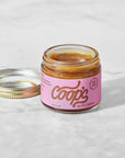 Jar of Coop's salted caramel on a light background