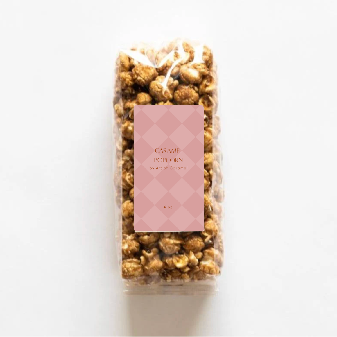Bag of caramel popcorn with a pink label on a white background