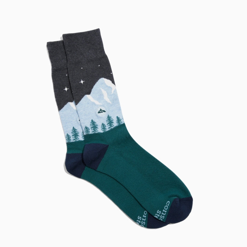 Sock with mountain and tree design on a white background