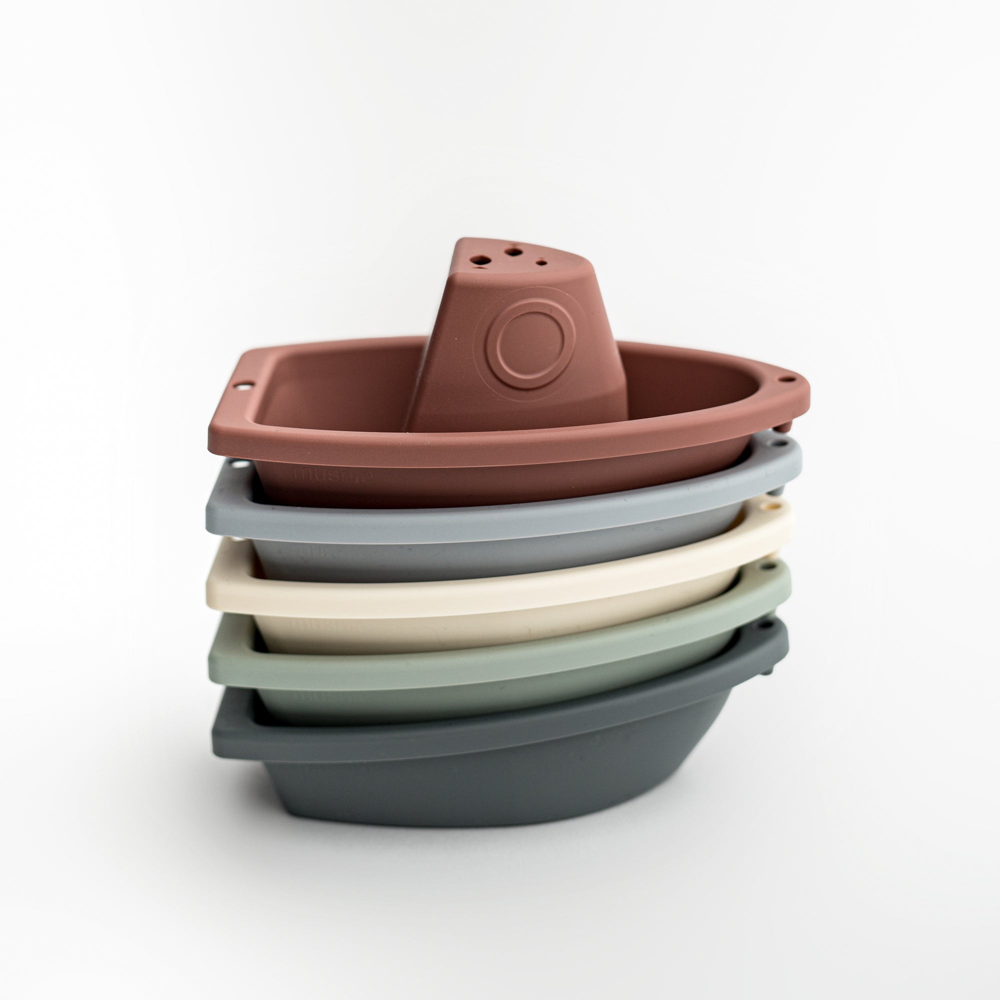 set of five stacking bath boats in various colors on a white background. 
