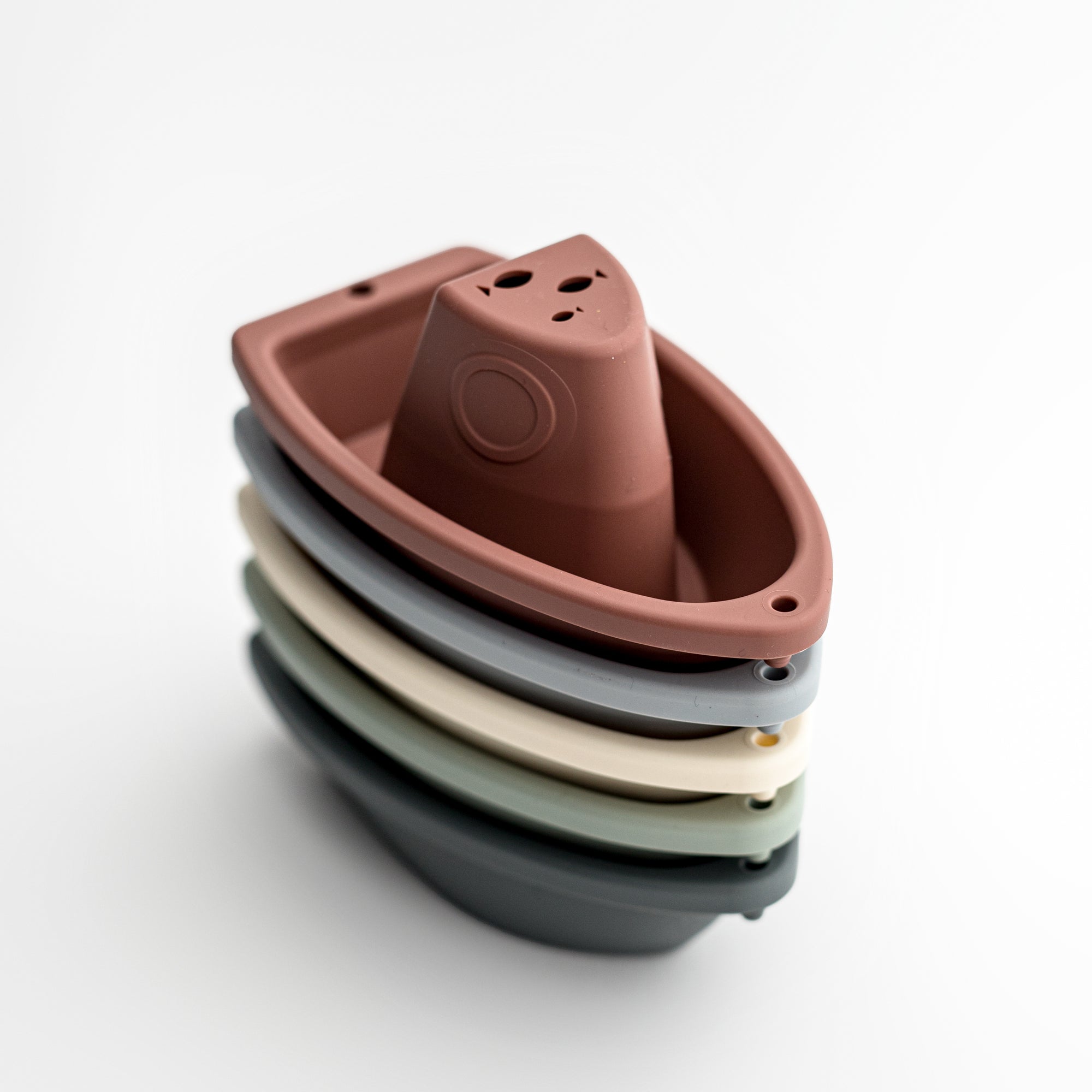 set of five stacking bath boats in various colors on a white background. 