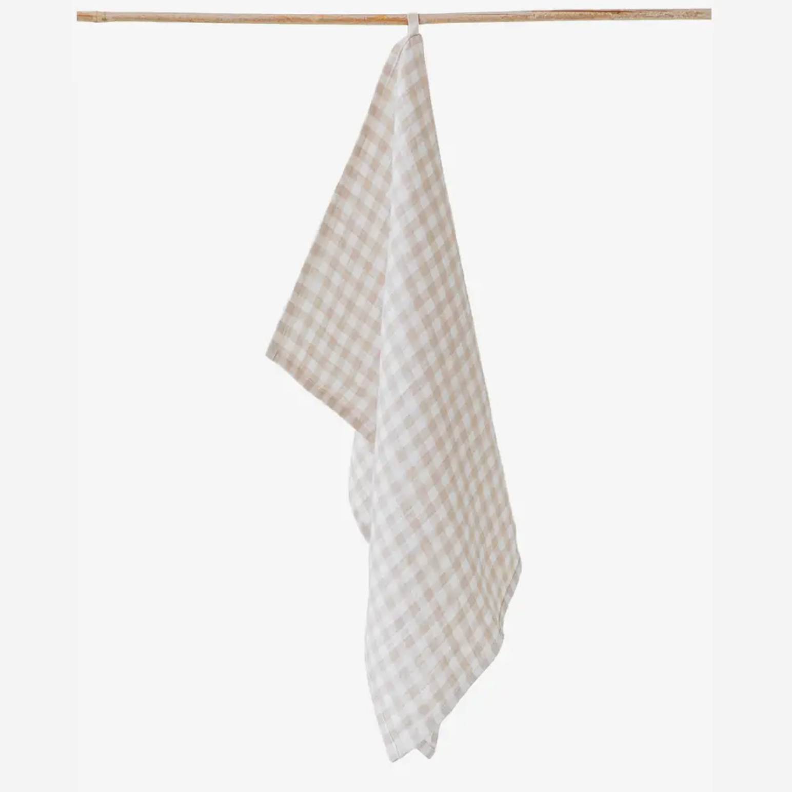 Checkered towel hanging on a wooden rod against a white background
