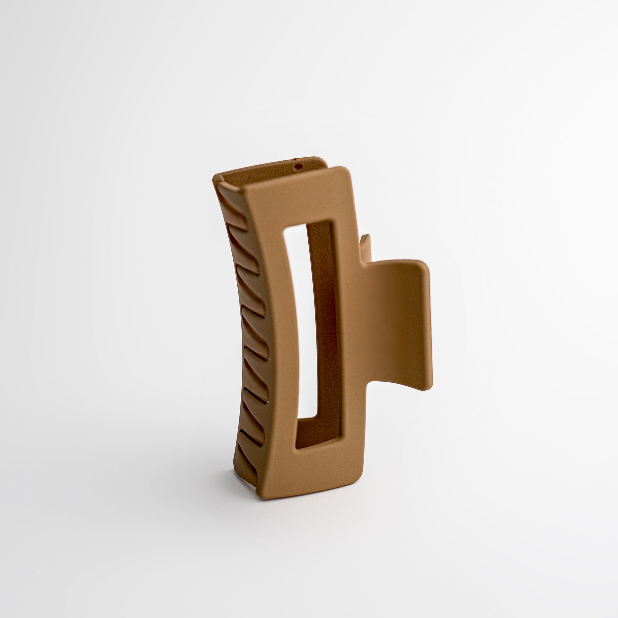 Taupe hair claw on a white background.