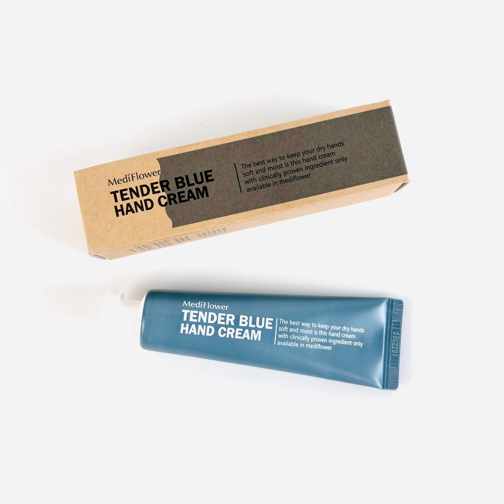 Tender blue hand cream in a brown box. Inside, it has a blue tube with white letters. 