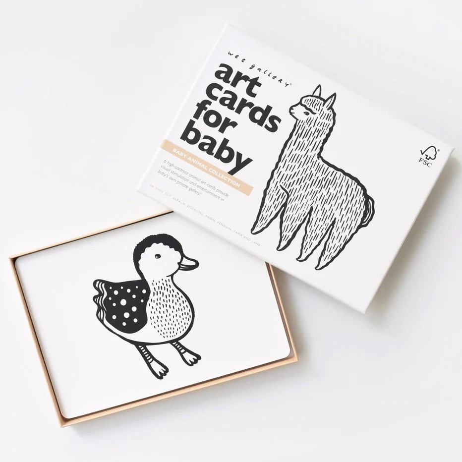 High-contrast black and white baby animal art cards featuring alpaca, duckling, fawn, penguin, tapir, and lamb illustrations for newborn visual development.
