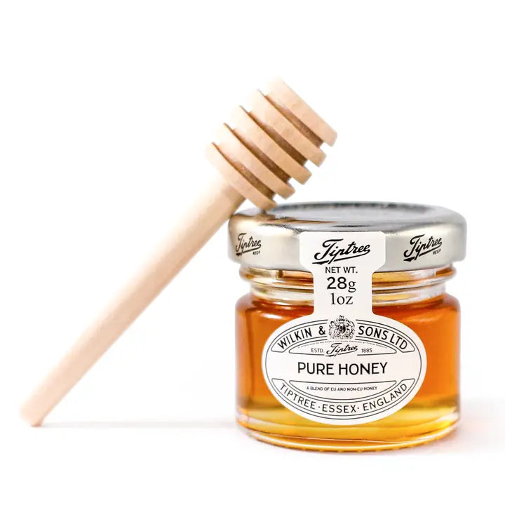 Glass jar of Tiptree Wildflower Honey, 28 g, with gold screw-on lid and white label featuring the Tiptree logo and floral illustration.
