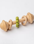 Natural wooden baby rattle with sage teething beads for infants.