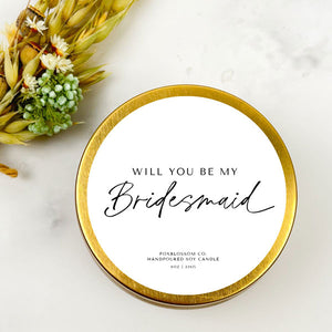 Gold 8 oz candle tin with white top that reads "Will you be my Bridesmaid" in black text