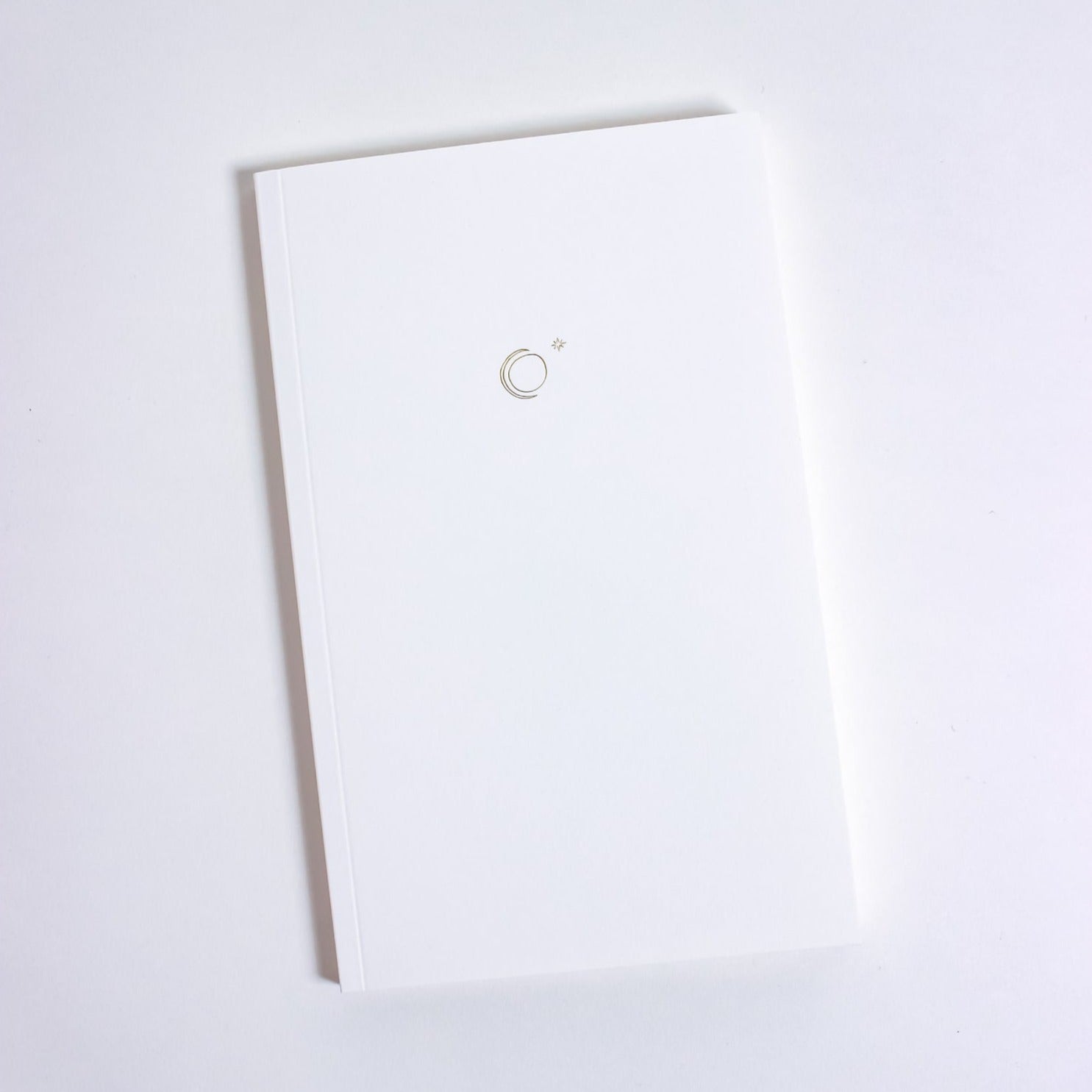 White journal with small gold foil pressed moon and star 