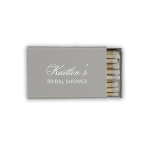 Gray personalized matchbox, reads "Kaitlin's Bridal Shower" in silver foil
