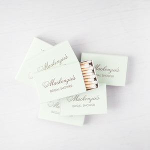 Green tea colored 2.22" x 1.375" x .46" personalized matchboxes with gold script. Approx. 22 white matches in each