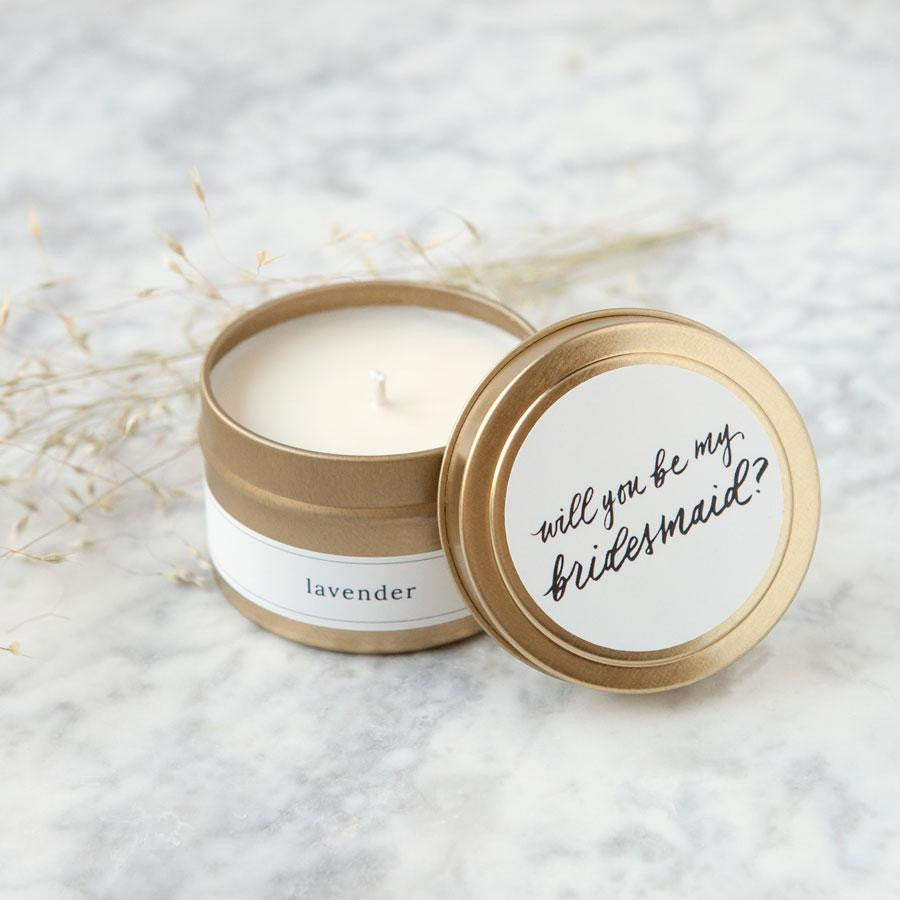 4 oz gold tin candle, lid reads "will you be my bridesmaid?" in black script on white background. Side reads "lavender"