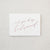 White envelope size card (approx. 3.5" x 5"), reads, "Will you be my bridesmaid?" in rose gold text.