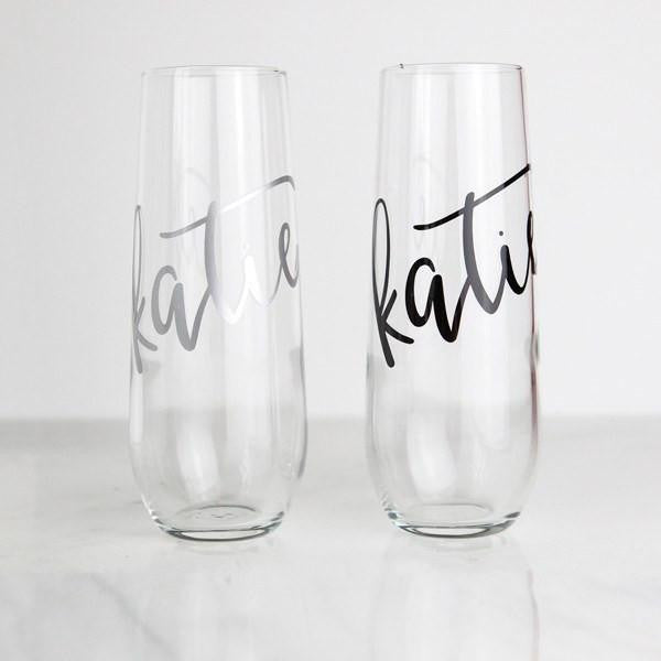 Champagne Flute- Personalized Stemless Flute with silver and black script names showing the name Katie.