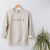 Custom Bride-to-Be Engagement or Bachelorette Sweatshirt with "engaged af" in lowercase script across chest.